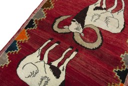Backside of handmade 2000s Persian Gabbeh rug showing knot structure and weave density