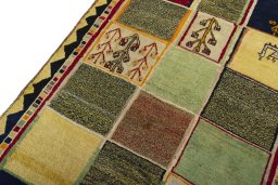 Backside of handmade 2000s Persian Gabbeh rug showing knot structure and weave density