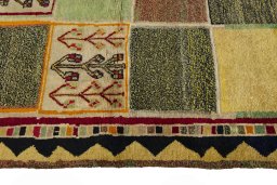 Close-up detail of 2000s Persian Gabbeh rug from Iran / Persia showing Wool weave