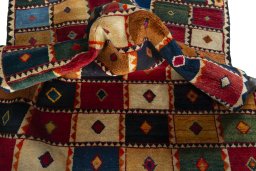 Corner detail of 2000s Persian Gabbeh rug showing border pattern and Wool pile