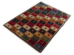 Corner detail of 2000s Persian Gabbeh rug showing border pattern and Wool pile