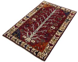 Corner detail of 2000s Persian Gabbeh rug showing border pattern and Wool pile