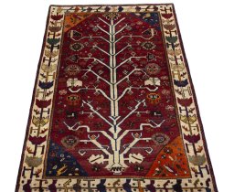 Surface texture of 2000s Persian Gabbeh rug with natural Wool and intricate pattern