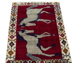 Surface texture of 2000s Persian Gabbeh rug with natural Wool and intricate pattern