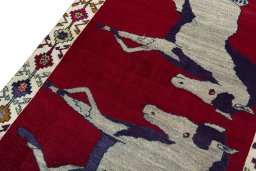 Backside of handmade 2000s Persian Gabbeh rug showing knot structure and weave density