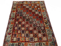 Surface texture of 1970s Persian Gabbeh rug with natural Wool and intricate pattern