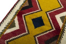 Backside of handmade 2000s Persian Gabbeh rug showing knot structure and weave density
