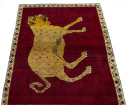 Surface texture of 2000s Persian Gabbeh rug with natural Wool and intricate pattern