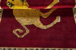 Full view of 2000s Persian Gabbeh rug from Iran / Persia, 172 × 127 cm in Red tones