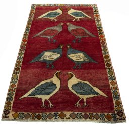 Surface texture of 2000s Persian Gabbeh rug with natural Wool and intricate pattern