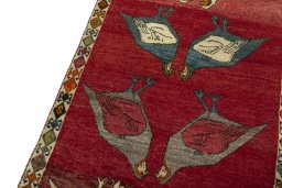 Backside of handmade 2000s Persian Gabbeh rug showing knot structure and weave density