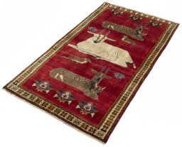 Corner detail of 2000s Persian Gabbeh rug showing border pattern and Wool pile