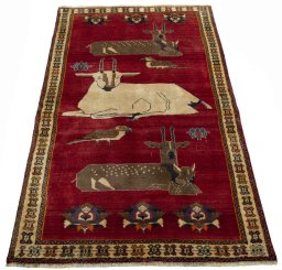 Surface texture of 2000s Persian Gabbeh rug with natural Wool and intricate pattern