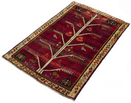 Corner detail of 2000s Persian Gabbeh rug showing border pattern and Wool pile