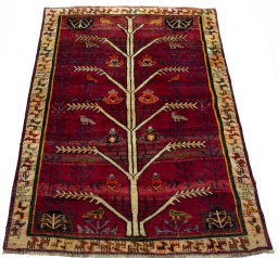 Surface texture of 2000s Persian Gabbeh rug with natural Wool and intricate pattern