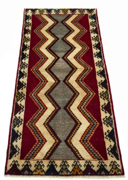 Surface texture of 2000s Persian Gabbeh rug with natural Wool and intricate pattern