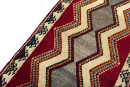 Backside of handmade 2000s Persian Gabbeh rug showing knot structure and weave density