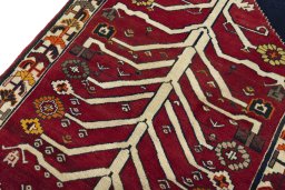 Backside of handmade 2000s Persian Gabbeh rug showing knot structure and weave density