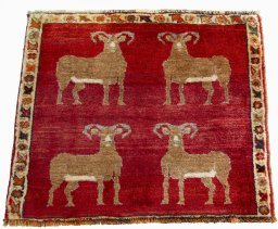 Surface texture of 2000s Persian Gabbeh rug with natural Wool and intricate pattern