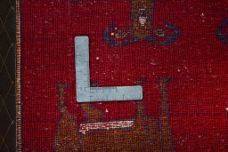 Backside of handmade 2000s Persian Gabbeh rug showing knot structure and weave density