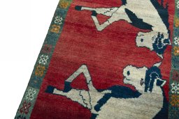 Backside of handmade 2000s Persian Gabbeh rug showing knot structure and weave density