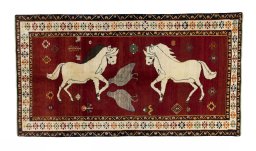 Full view of 2000s Persian Gabbeh rug from Iran / Persia, 281 × 154 cm in Red tones