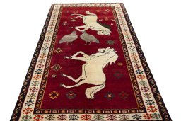 Surface texture of 2000s Persian Gabbeh rug with natural Wool and intricate pattern