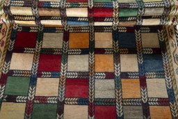 Full view of 2000s Persian Gabbeh rug from Iran / Persia, 206 × 133 cm in Multi Color tones