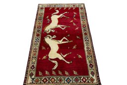 Surface texture of 2000s Persian Gabbeh rug with natural Wool and intricate pattern