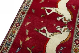 Backside of handmade 2000s Persian Gabbeh rug showing knot structure and weave density