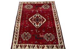 Surface texture of 2000s Persian Gabbeh rug with natural Wool and intricate pattern