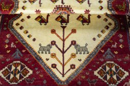 Corner detail of 2000s Persian Gabbeh rug showing border pattern and Wool pile