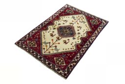 Corner detail of 2000s Persian Gabbeh rug showing border pattern and Wool pile