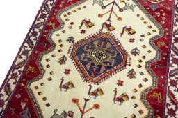Backside of handmade 2000s Persian Gabbeh rug showing knot structure and weave density