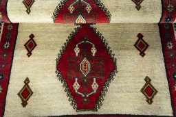 Full view of 2000s Persian Gabbeh rug from Iran / Persia, 150 × 108 cm in Beige tones