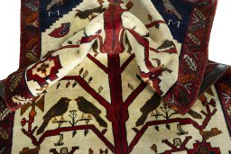 Corner detail of 2000s Persian Gabbeh rug showing border pattern and Wool pile