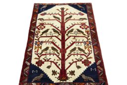 Surface texture of 2000s Persian Gabbeh rug with natural Wool and intricate pattern