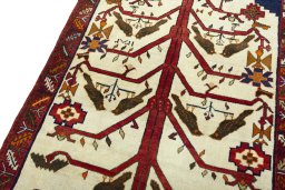 Backside of handmade 2000s Persian Gabbeh rug showing knot structure and weave density