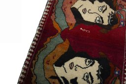 Backside of handmade 2000s Persian Gabbeh rug showing knot structure and weave density