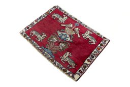 Corner detail of 2000s Persian Gabbeh rug showing border pattern and Wool pile