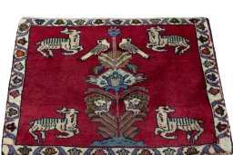 Surface texture of 2000s Persian Gabbeh rug with natural Wool and intricate pattern
