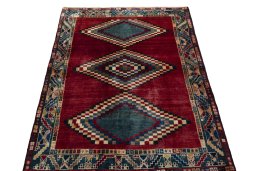 Surface texture of 2000s Persian Gabbeh rug with natural Wool and intricate pattern