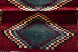 Full view of 2000s Persian Gabbeh rug from Iran / Persia, 182 × 132 cm in Red tones