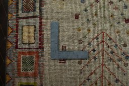 Corner detail of New Persian Gabbeh rug showing border pattern and Wool pile