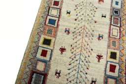Backside of handmade New Persian Gabbeh rug showing knot structure and weave density