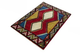 Corner detail of 2000s Persian Gabbeh rug showing border pattern and Wool pile