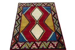 Surface texture of 2000s Persian Gabbeh rug with natural Wool and intricate pattern