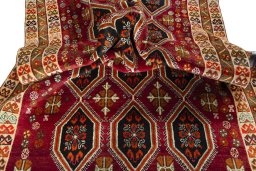 Corner detail of 2000s Persian Gabbeh rug showing border pattern and Wool pile