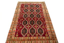Surface texture of 2000s Persian Gabbeh rug with natural Wool and intricate pattern