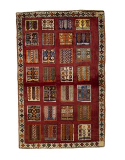 Full view of 2000s Persian Gabbeh rug from Iran / Persia, 175 × 114 cm in Red tones